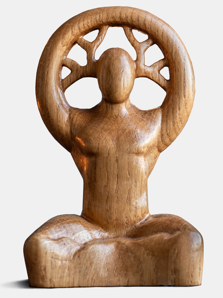 Close-up of the minimalist handcrafted oak Cernunnos statue, showcasing the natural beauty of the wood.