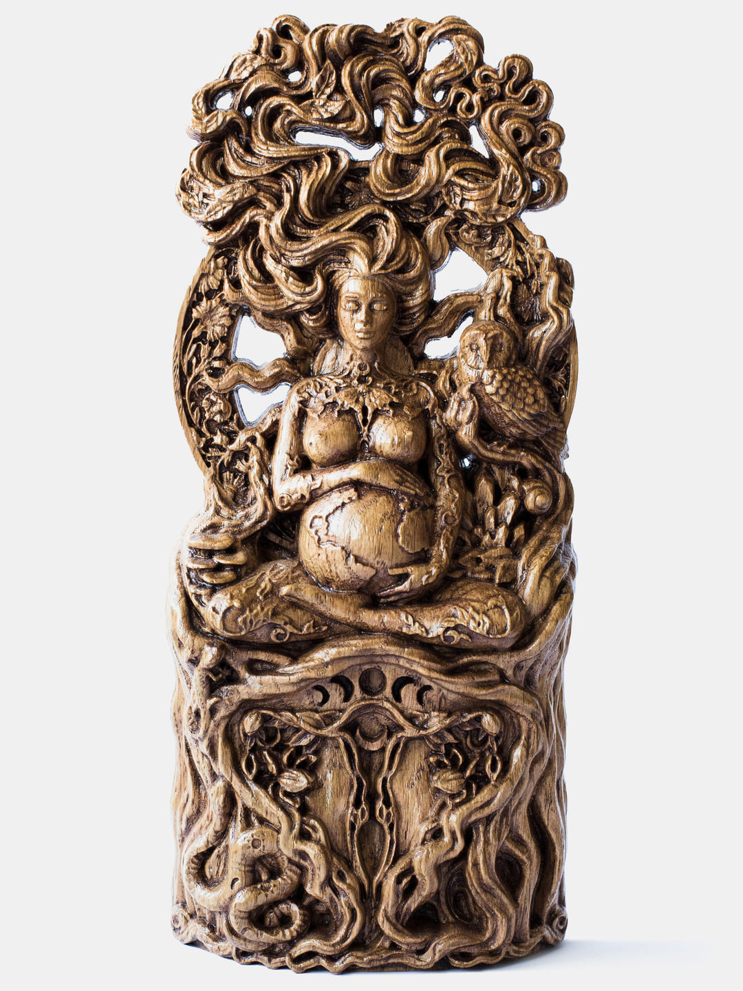Close-up of the handcrafted oak Gaia statue, showcasing Gaia sitting in a lotus position, embracing Earth with the moon on her shoulders and a butterfly on her chest.