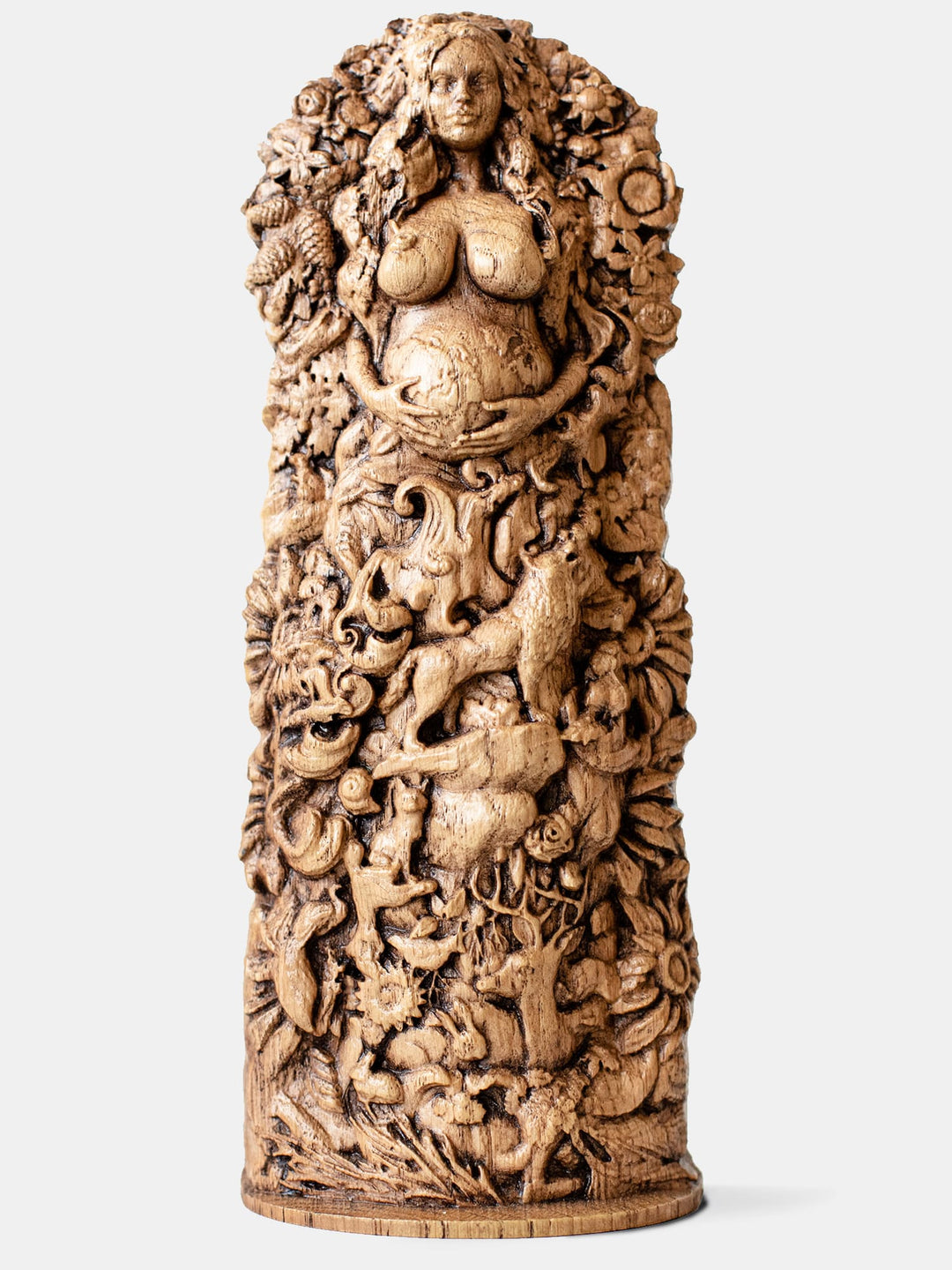 Close-up of the handcrafted oak Gaia statue, showcasing detailed carvings of Gaia surrounded by various animals, insects, birds, and plants.