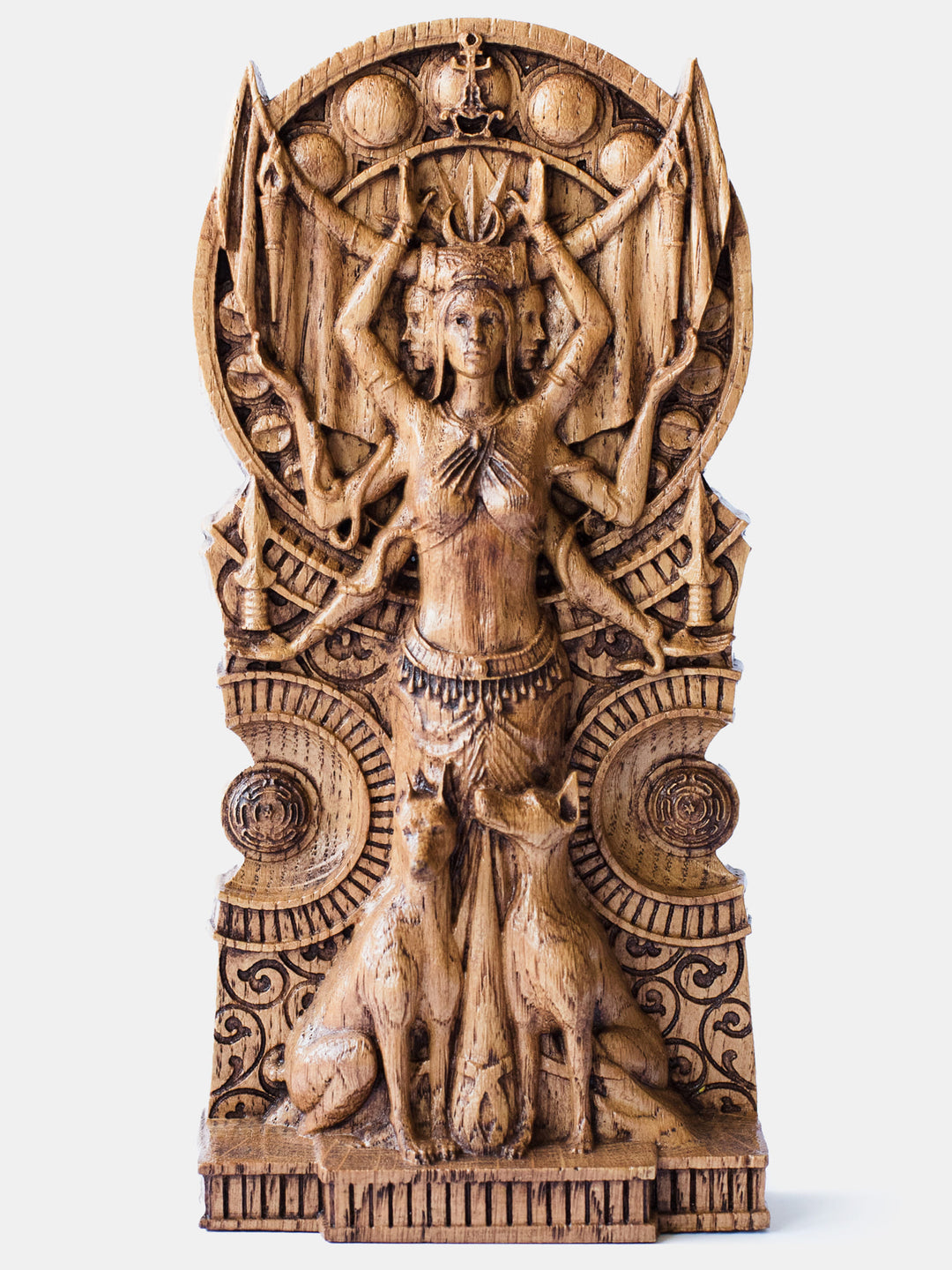 Close-up of the handcrafted oak Hekate statue, showcasing her three faces, key attributes levitating over her six arms, and the moon phases in the background.