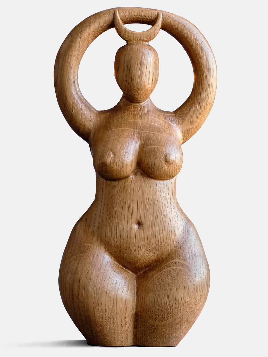 Close-up of the handcrafted oak Moon Goddess statue, showcasing the minimalist design and natural wood grain.