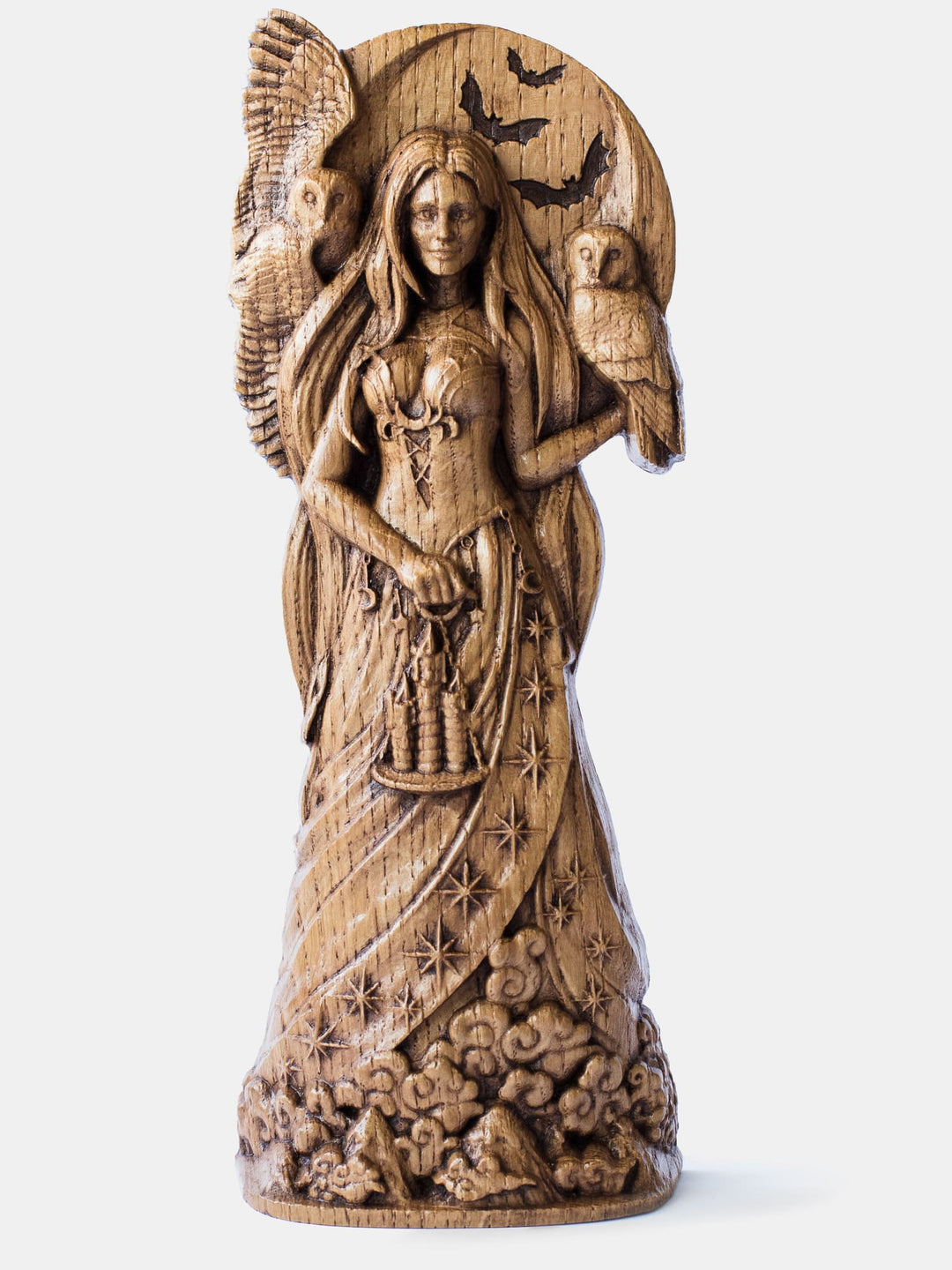 Close-up of the handcrafted oak Nyx statue, showcasing the goddess standing above mountains and clouds with the moon and bats behind her.
