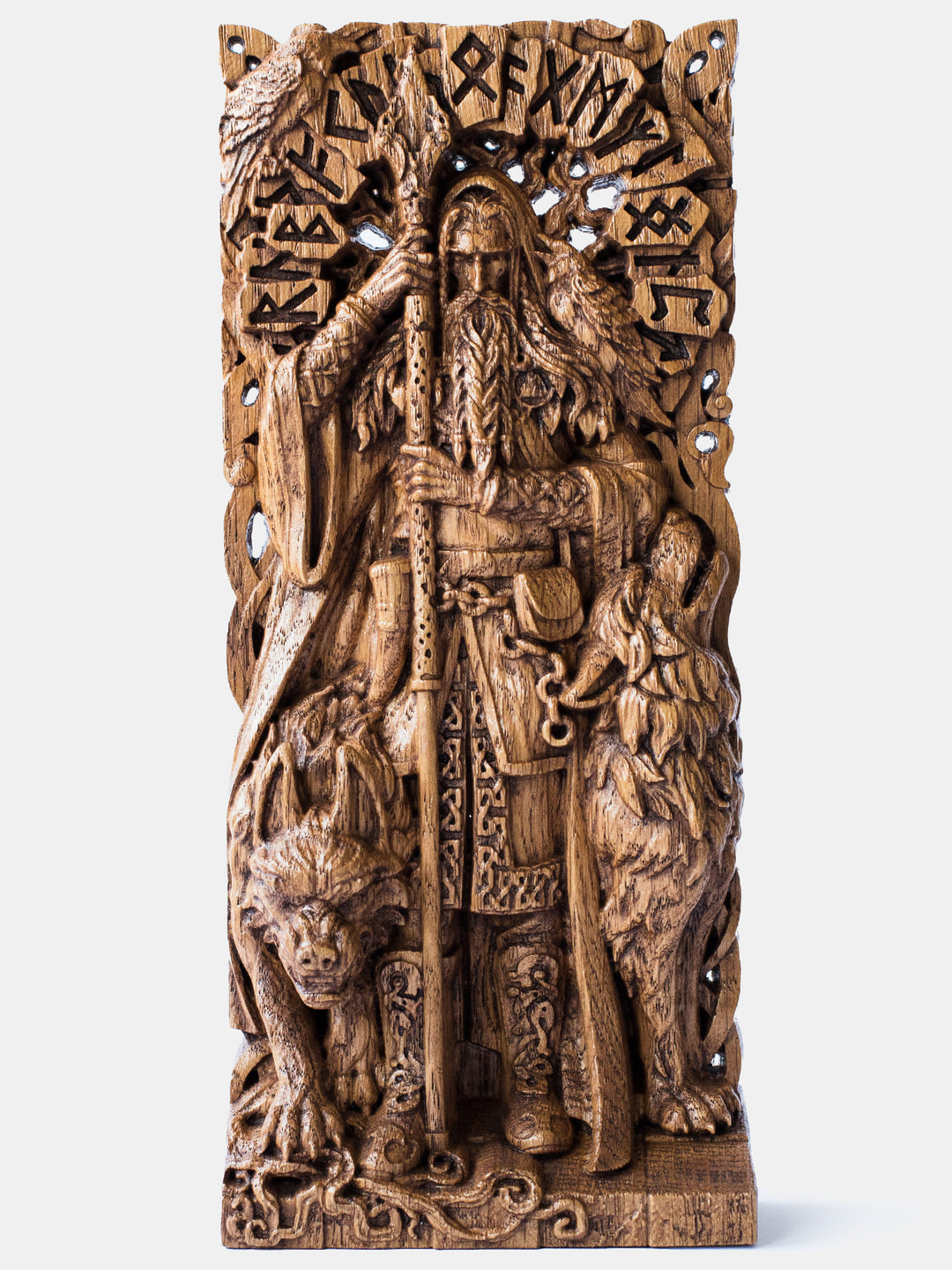 Close-up of the handcrafted oak Odin statue, showcasing the Norse All-Father with Yggdrasil and large runes in the background.