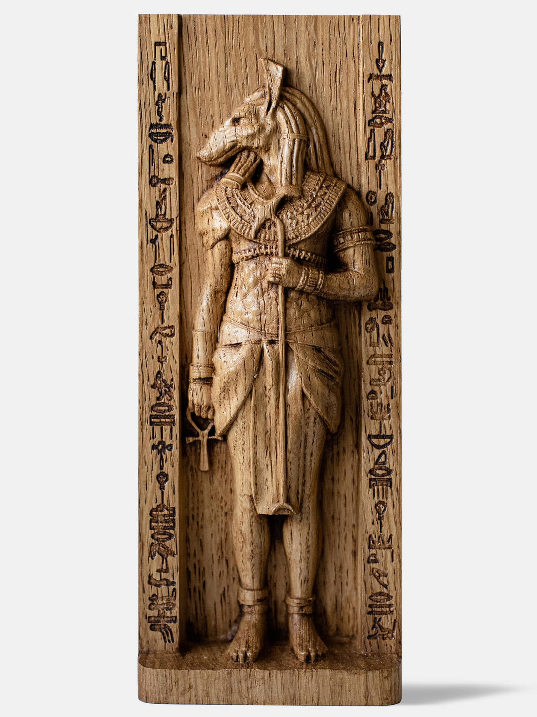 Close-up of the handcrafted oak Set statue, showcasing the Egyptian God of Chaos with his unique head and traditional Egyptian attire.