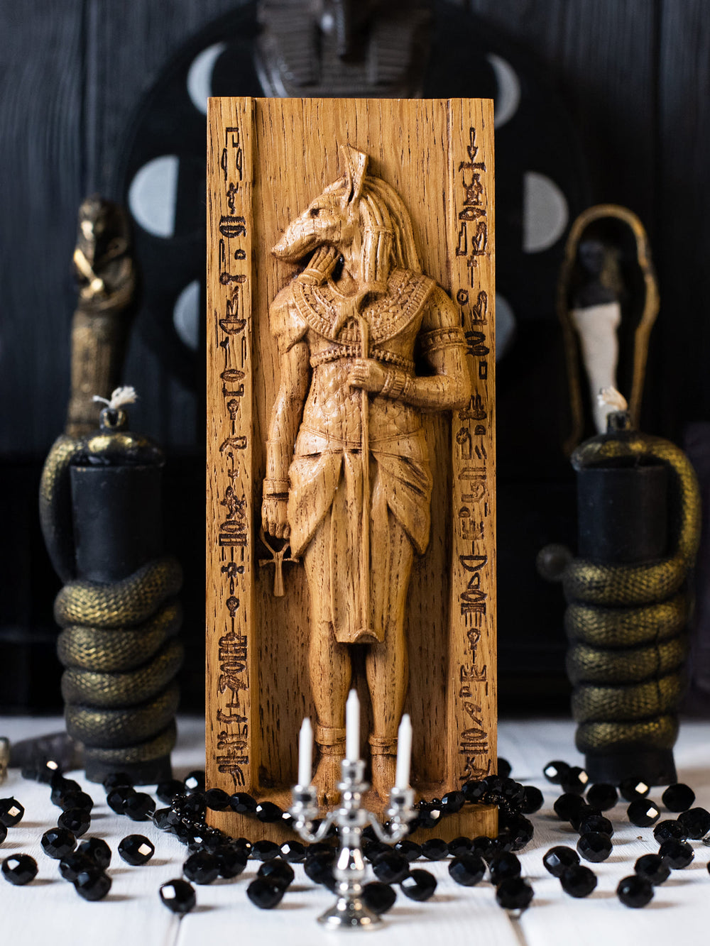 Full view of the Set statue from the front, highlighting its dimensions and intricate design featuring the ankh and was-scepter.