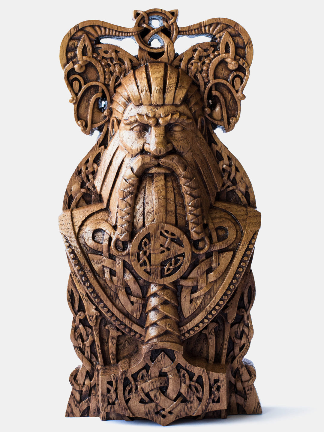 Close-up of the intricately carved oak Thor bust, showcasing the Norse God of Thunder with Mjolnir and his goats, adorned with Scandinavian knot patterns.