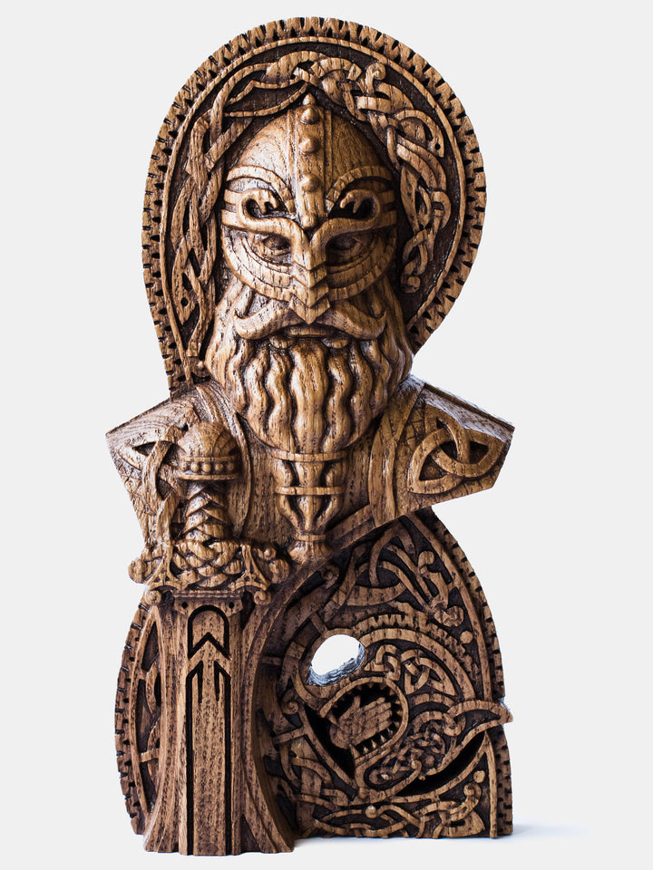Close-up of the handcrafted oak Týr bust, showcasing the Norse God of War with intricate Scandinavian knotwork and his sword.