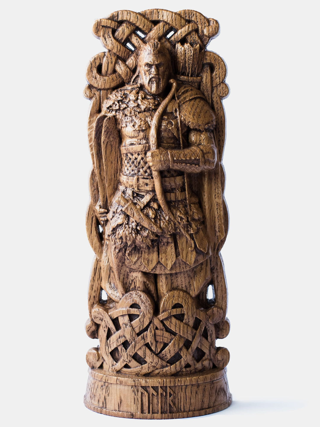 Close-up of the handcrafted oak Ullr statue, showcasing the Norse God of Winter holding a bow and skis, as depicted in the lore of the Edda.