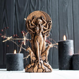 An altar for a Hecate ritual with candles and symbols