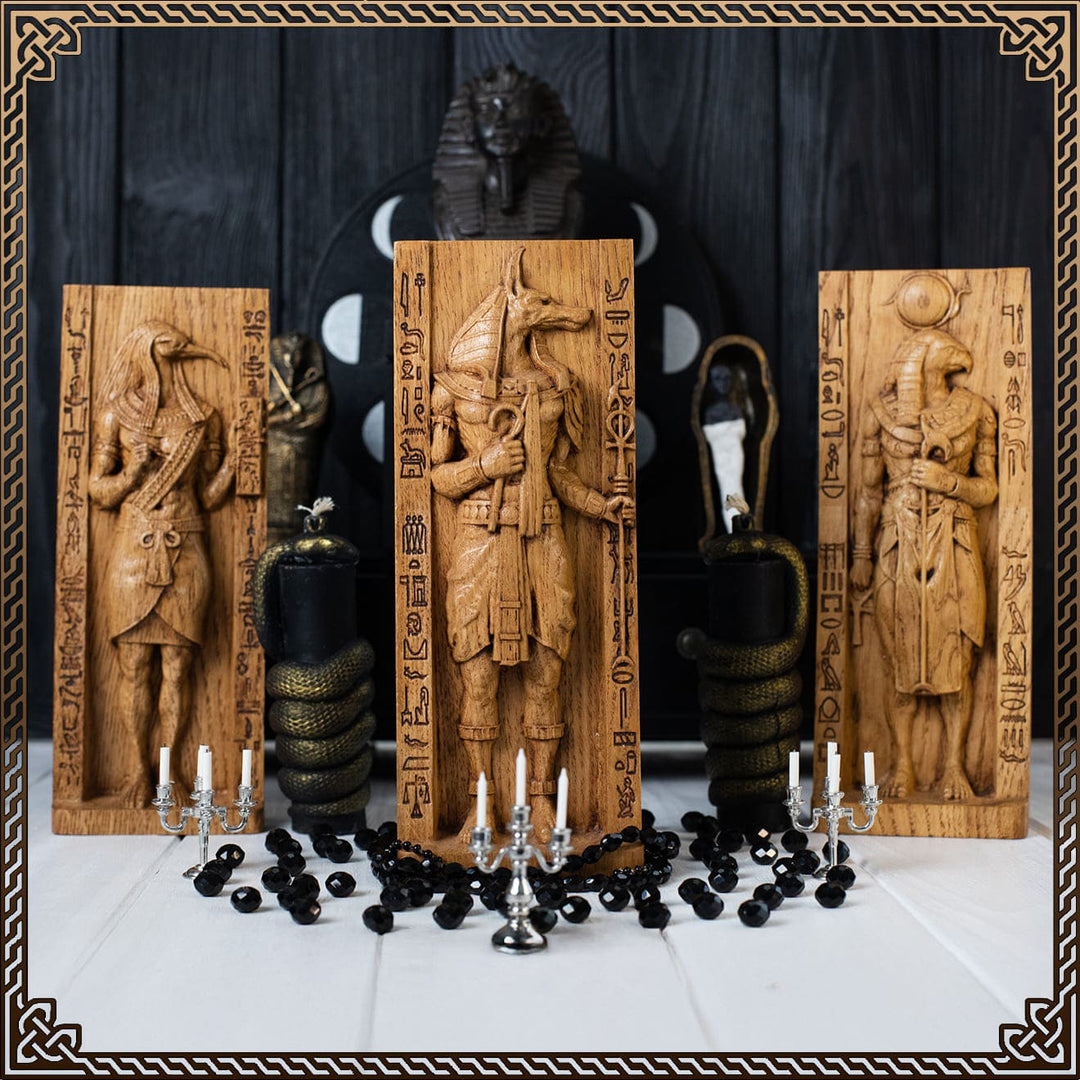 Wooden egypt statues of Anubis, Thoth, and Ra surrounded by ritual altar decor — handcrafted egypt dog statue, statue from egypt with hieroglyphs for pagan worship.