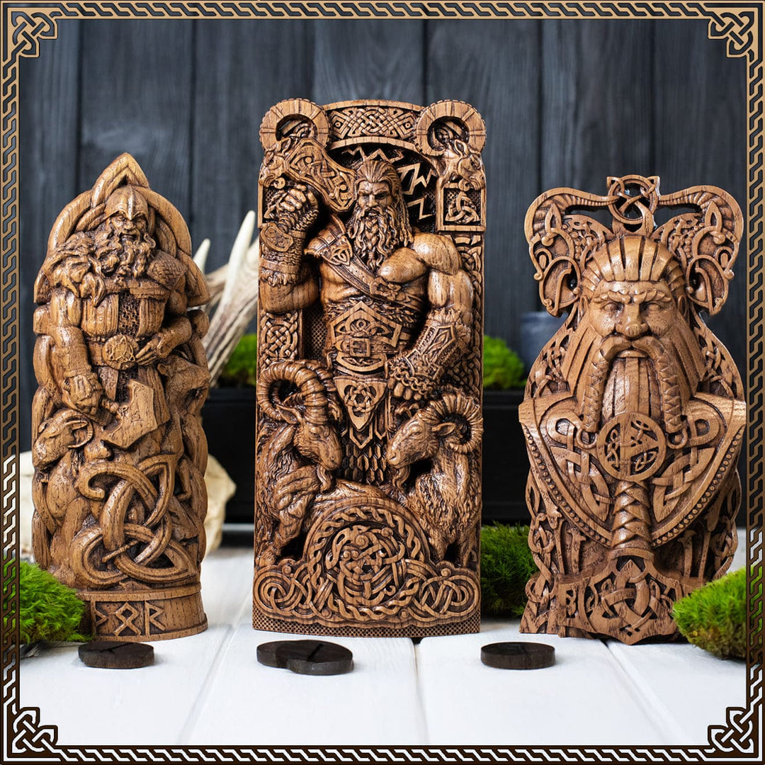 Ancient-style wooden Thor god statuettes with Mjölnir, showcasing Norse Thor god power and protection