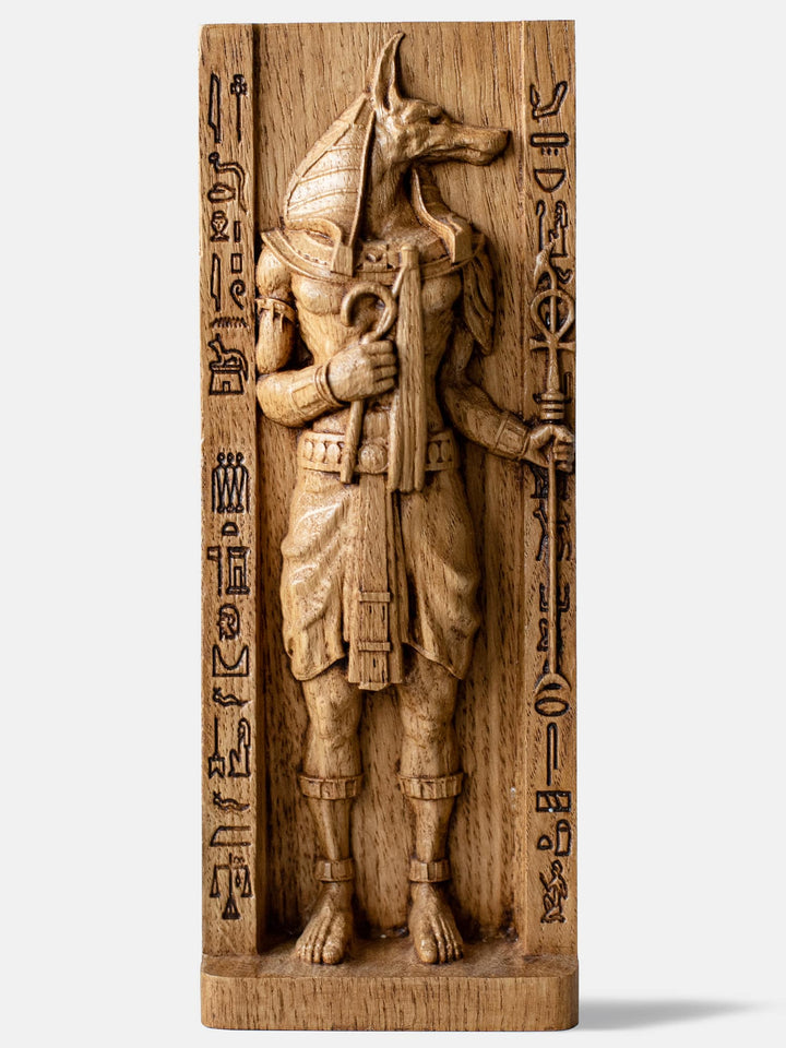 Close-up of the handcrafted oak Anubis statue, showcasing detailed carvings and oak wood grain.
