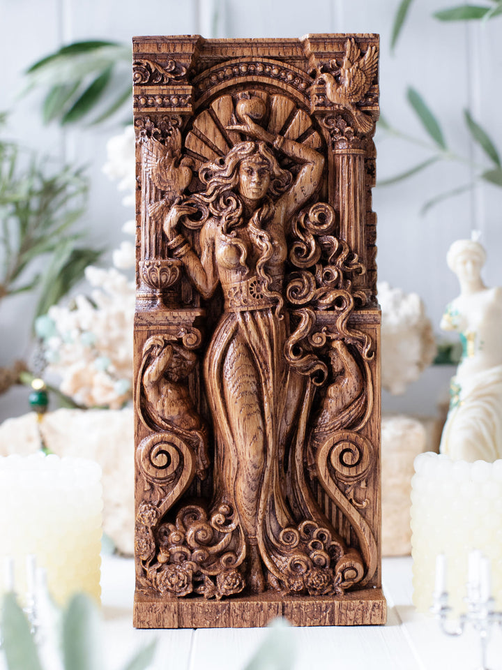 Full view of the Aphrodite statue from the front, highlighting its dimensions and intricate design, featuring doves and a cup of wine.
