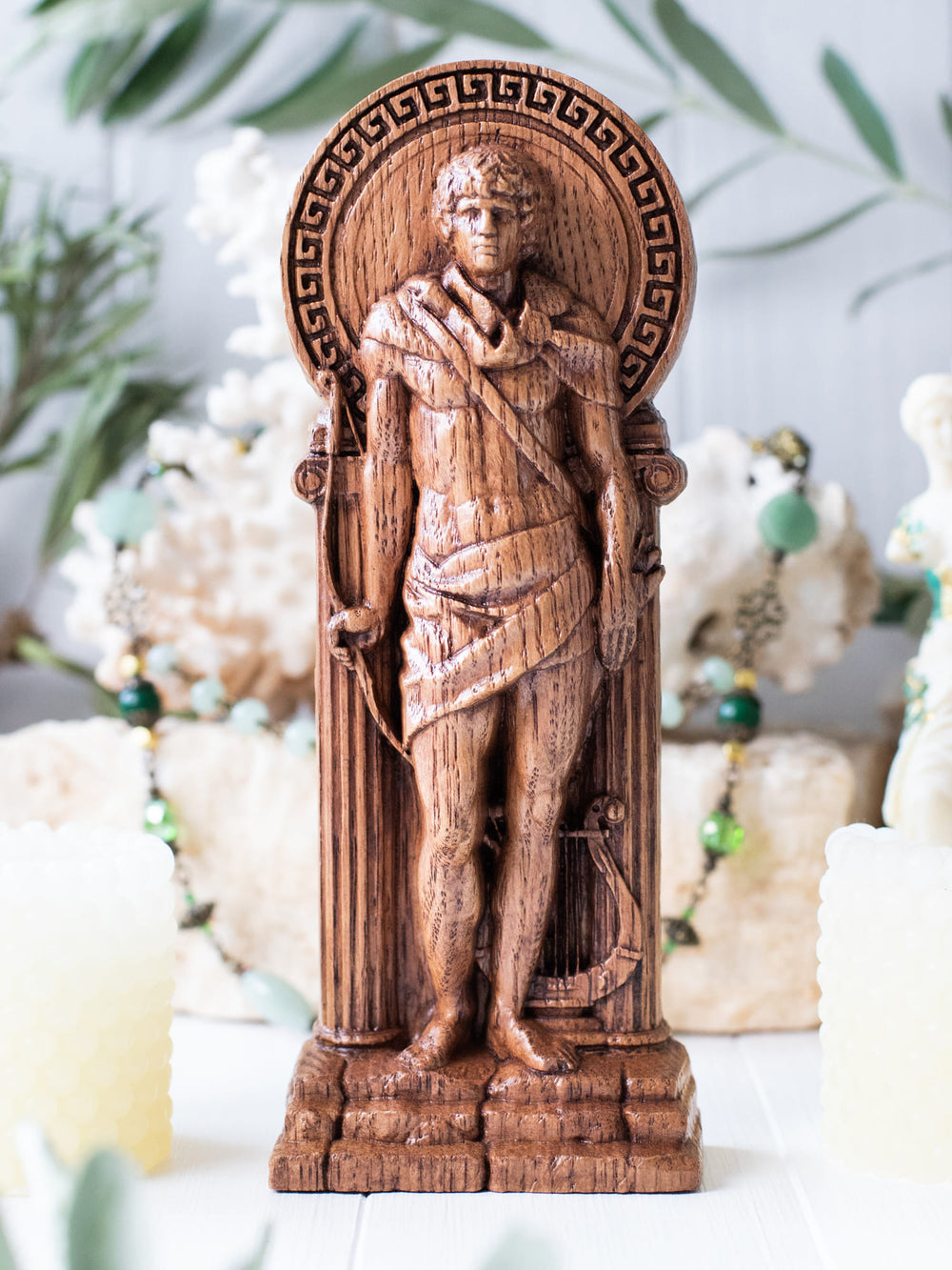Full view of the Apollo statue from the front, highlighting its dimensions and intricate design against a plain background.