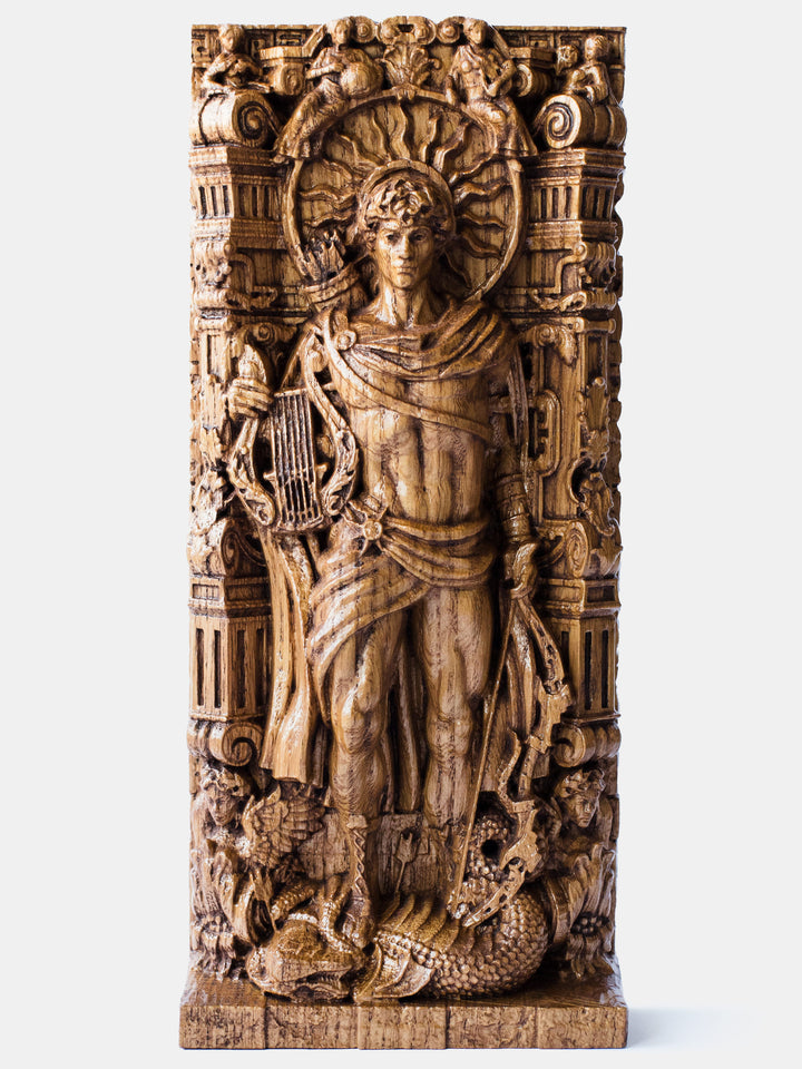 Close-up of the handcrafted oak Apollo statue, showcasing detailed carvings of the nine muses and a musical lyre.