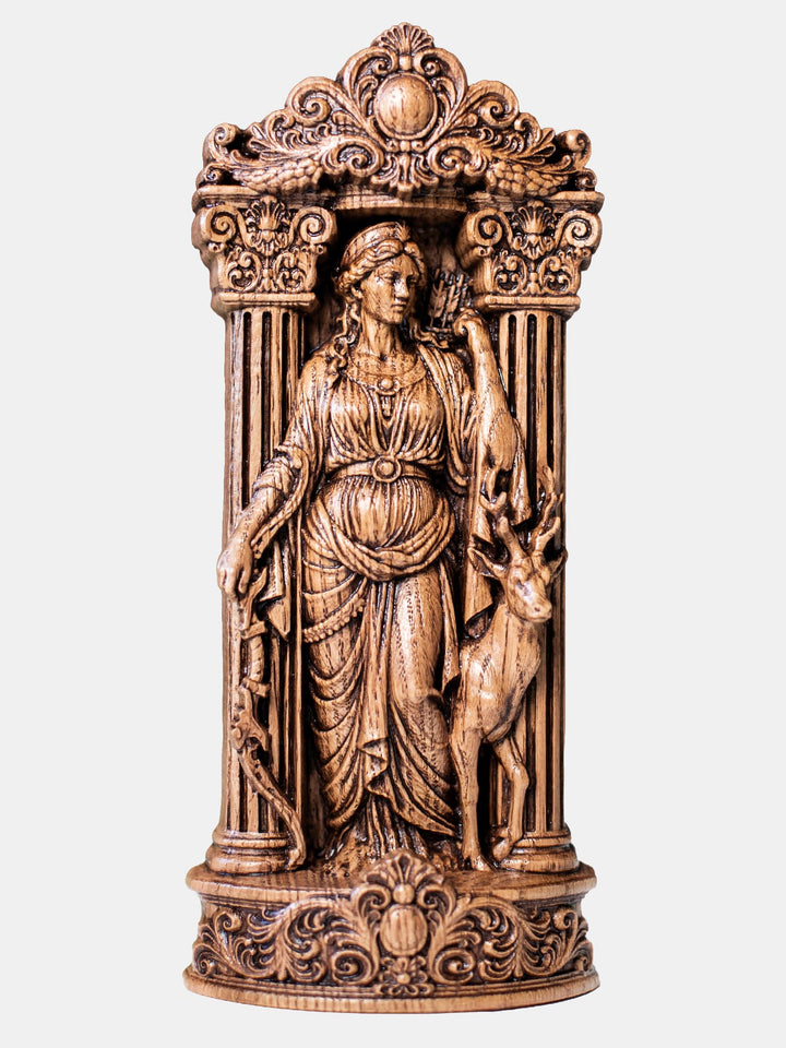 Handcrafted Artemis statue standing among ancient architecture with bow in hand and reaching for an arrow.
