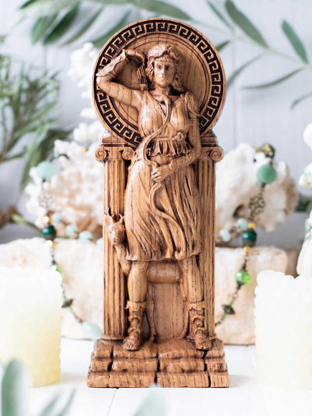 Full view of the Artemis statue from the front, highlighting its dimensions and intricate design, featuring a crescent moon and a deer.