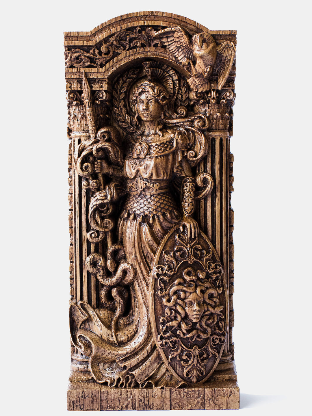 Close-up of the handcrafted oak Athena statue, showcasing detailed carvings, including a spear with a snake and an owl.