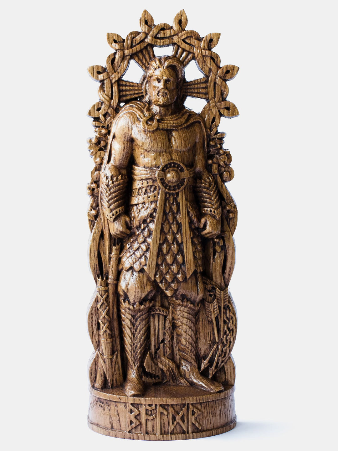 Close-up of the handcrafted oak Baldr statue, showcasing detailed carvings of mistletoe and a sun.