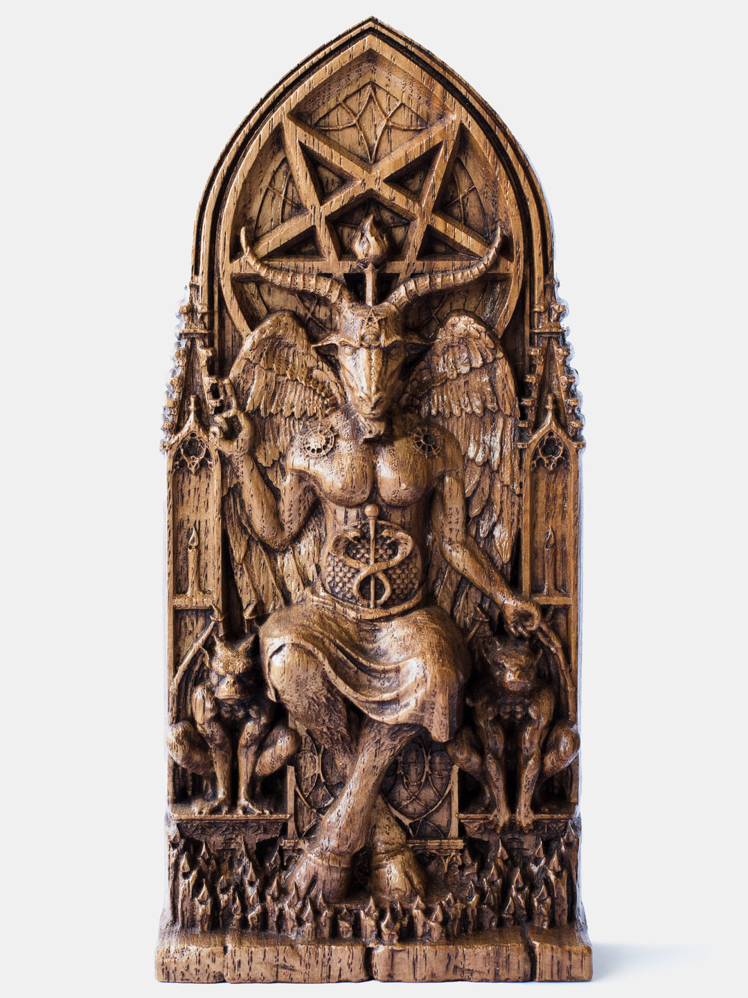Close-up of the handcrafted oak Baphomet statue, showcasing detailed carvings of gargoyle statues and lit candles.