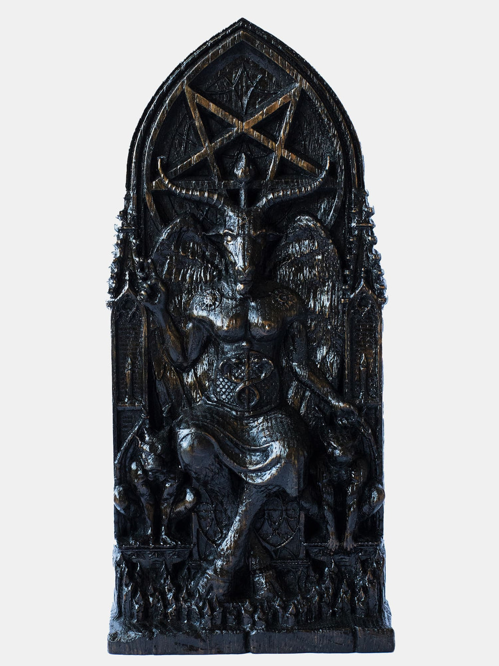 Close-up of the handcrafted wooden Baphomet blak color statue, showcasing detailed carvings of gargoyle statues and lit candles.
