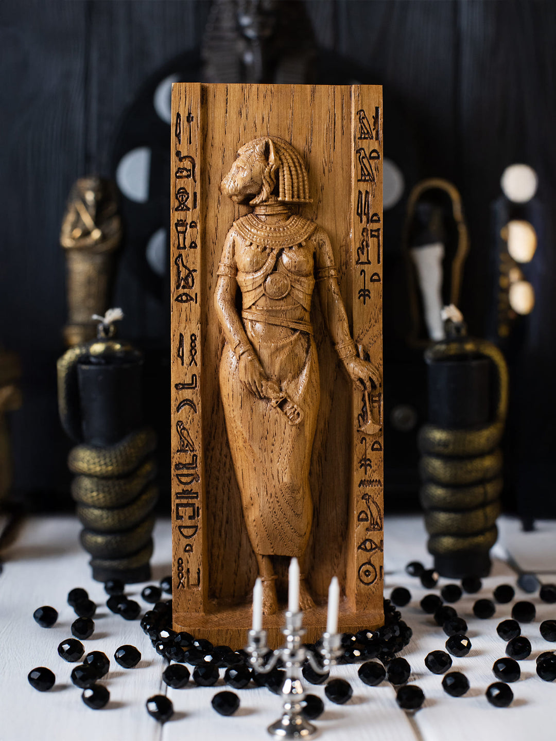 Full view of the Bastet statue from the front, highlighting its dimensions and intricate design, featuring cats at her feet.
