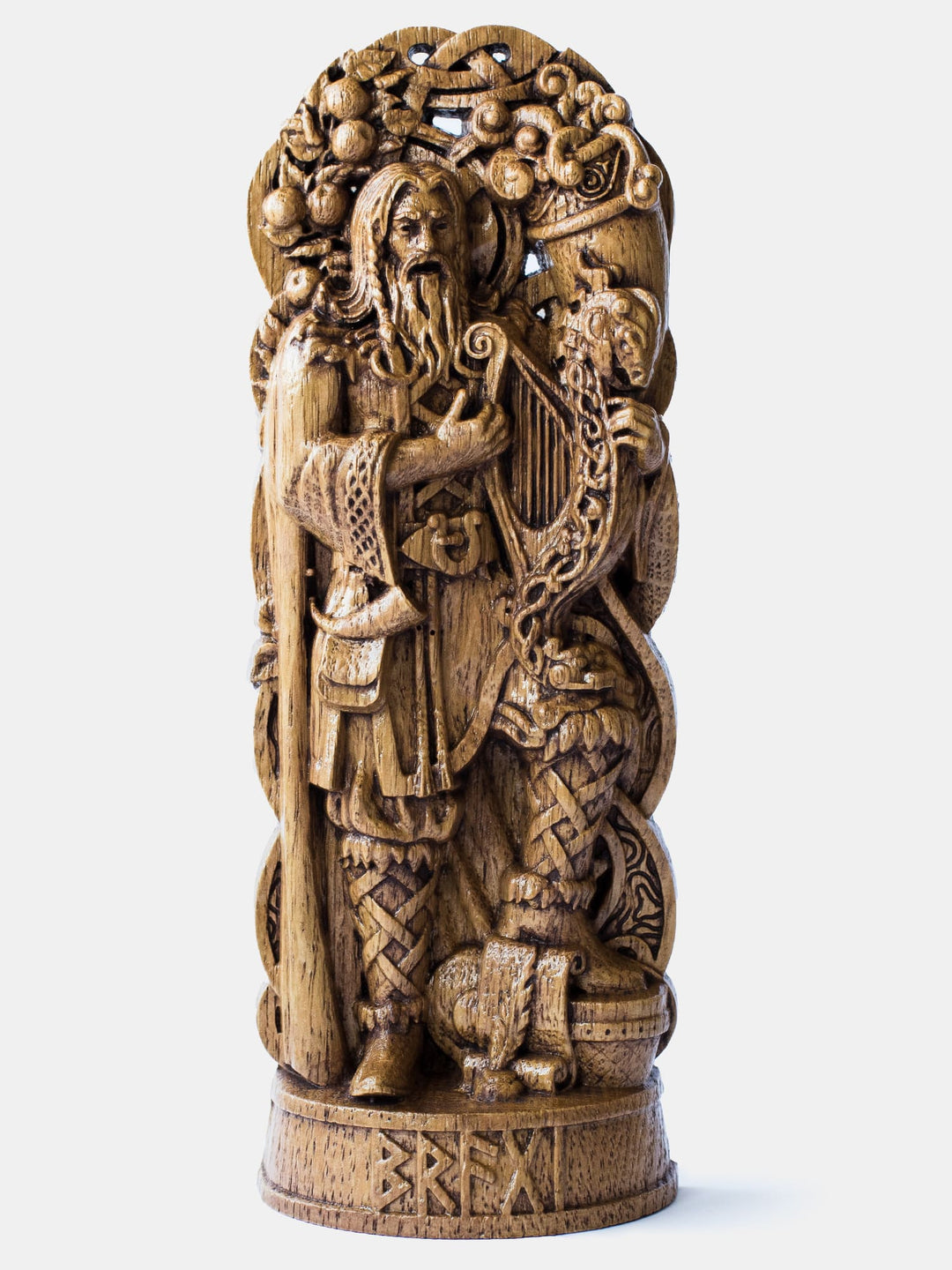 Close-up of the handcrafted oak Bragi statue, showcasing detailed carvings of Bragi singing and playing a musical instrument.