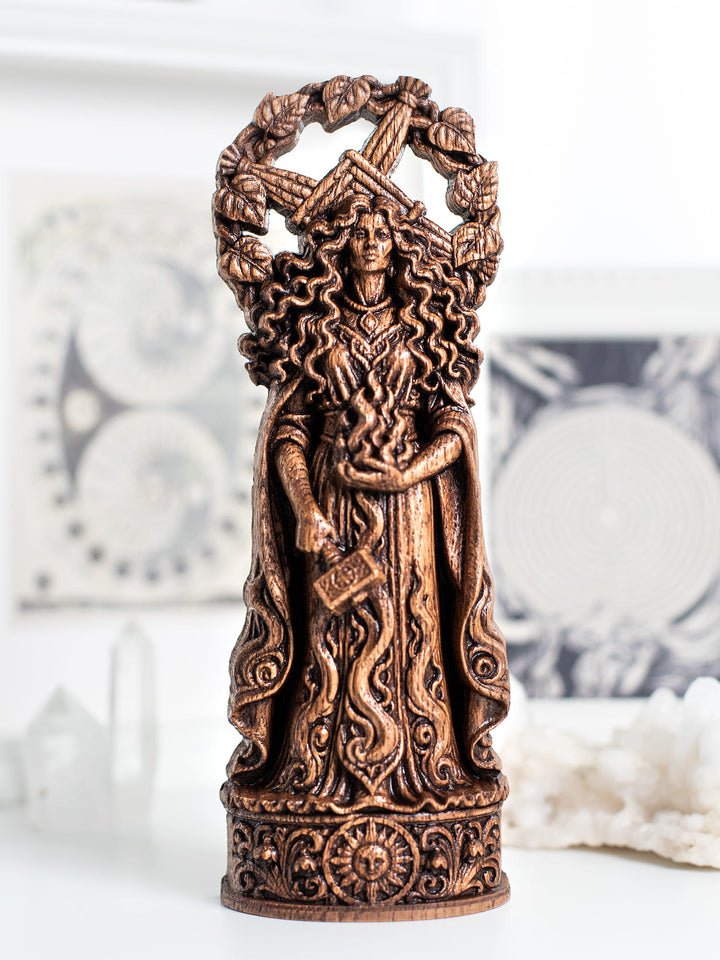Handmade oak wood Brigid statue with antique patina inspired by the Tuatha Dé Danann and Celtic pagan tradition.
