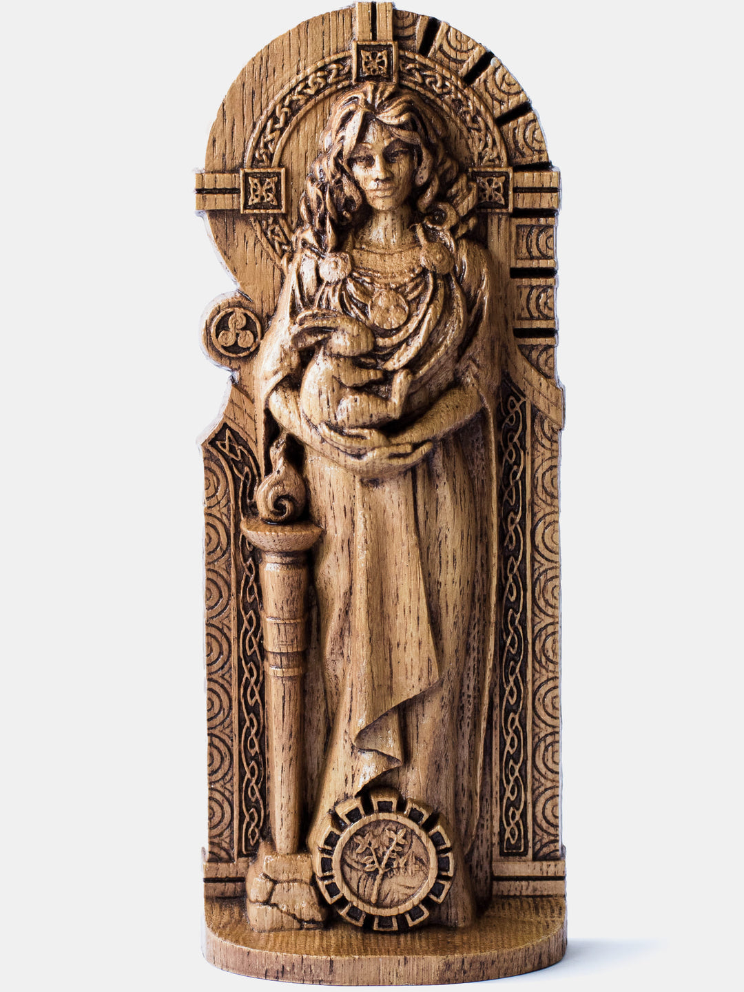 Brigid the Healer oak figurine depicting the Celtic goddess cradling a rabbit with a plant at her feet.