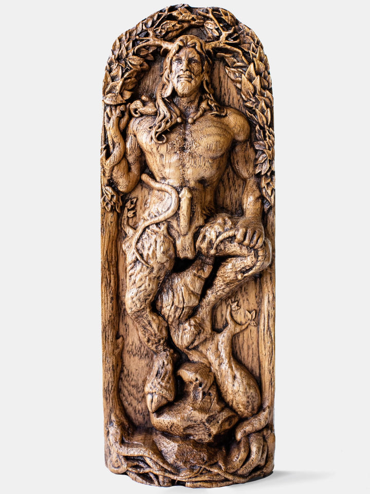 Close-up of the handcrafted oak Cernunnos statue, showcasing detailed carvings of Cernunnos with goat legs holding a snake and a torc.