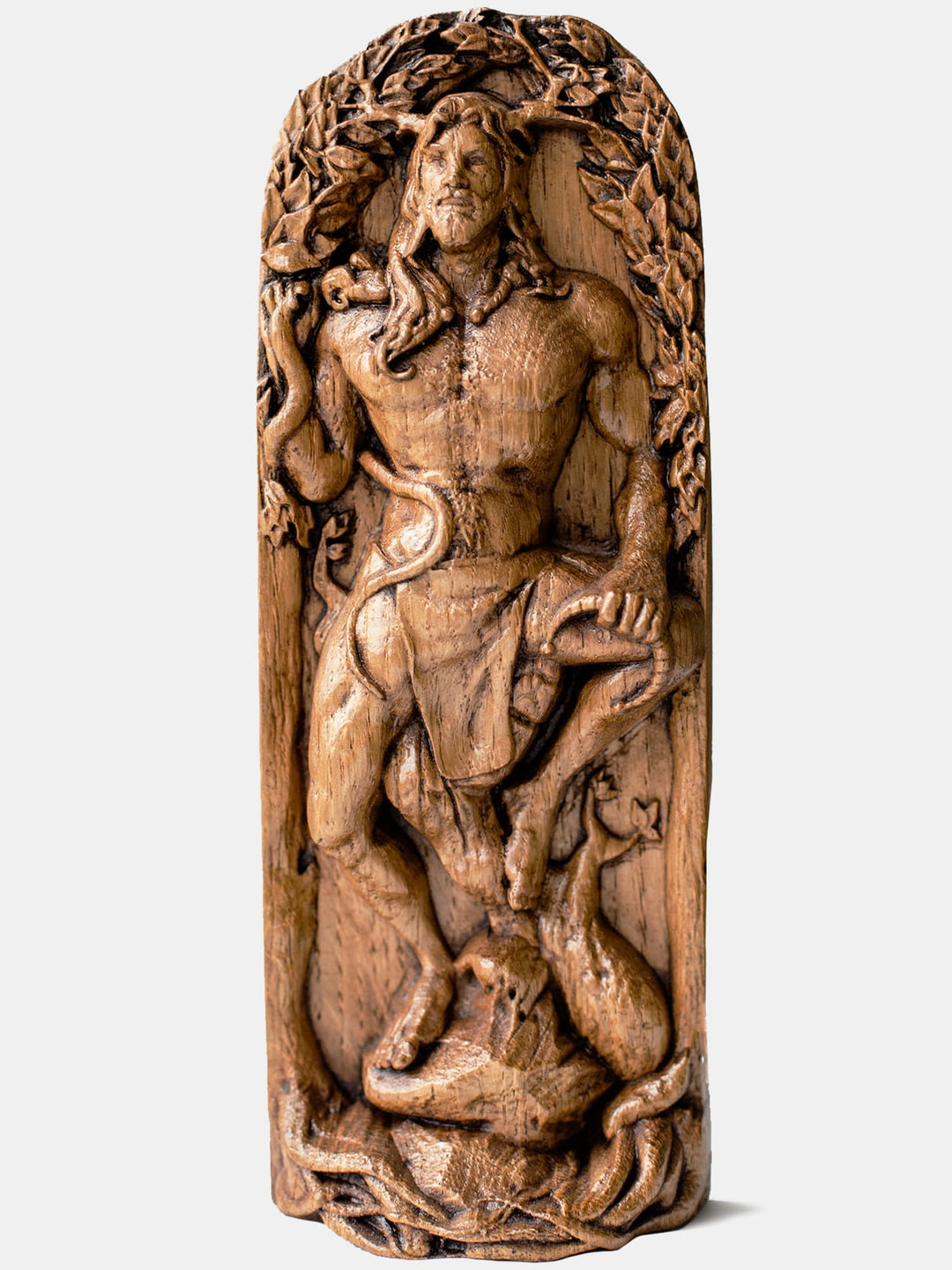 Close-up of the handcrafted oak Cernunnos statue, showcasing detailed carvings of Cernunnos holding a snake and a torc.