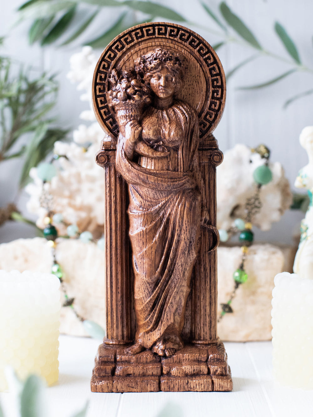 Full view of the Demeter statue from the front, highlighting its dimensions and intricate design against a plain background.