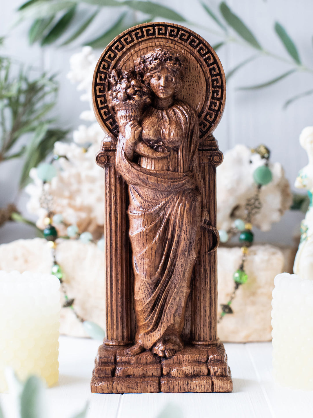 Full view of the Demeter statue from the front, highlighting its dimensions and intricate design against a plain background.