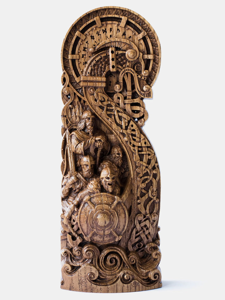  Close-up of the handcrafted oak Viking Ship Drakkar statue, showcasing detailed carvings of battle-ready Vikings on board.