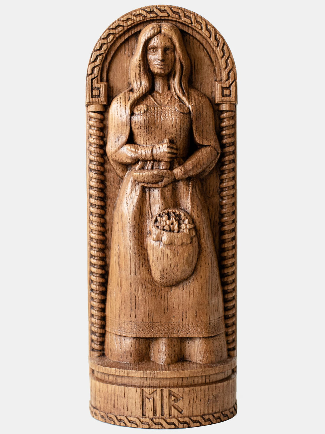 Close-up of the handcrafted oak Eir statue, showcasing detailed carvings of the goddess with a calm and nurturing stance.
