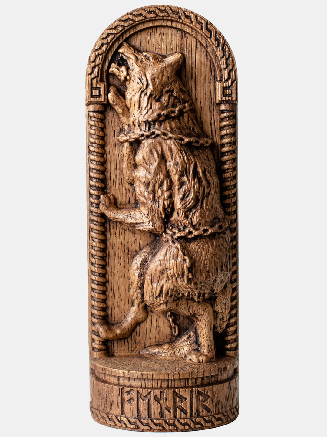 Close-up of the handcrafted oak Fenrir statue, showcasing detailed carvings of Fenrir breaking his shackles.