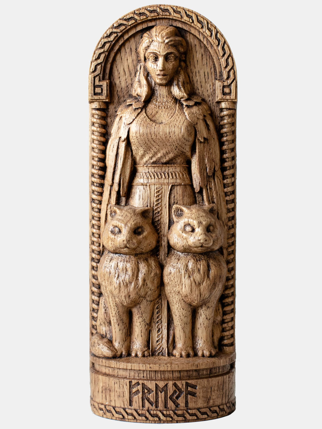 Close-up of the handcrafted oak Freya statue, showcasing detailed carvings of Freya with her two cats.