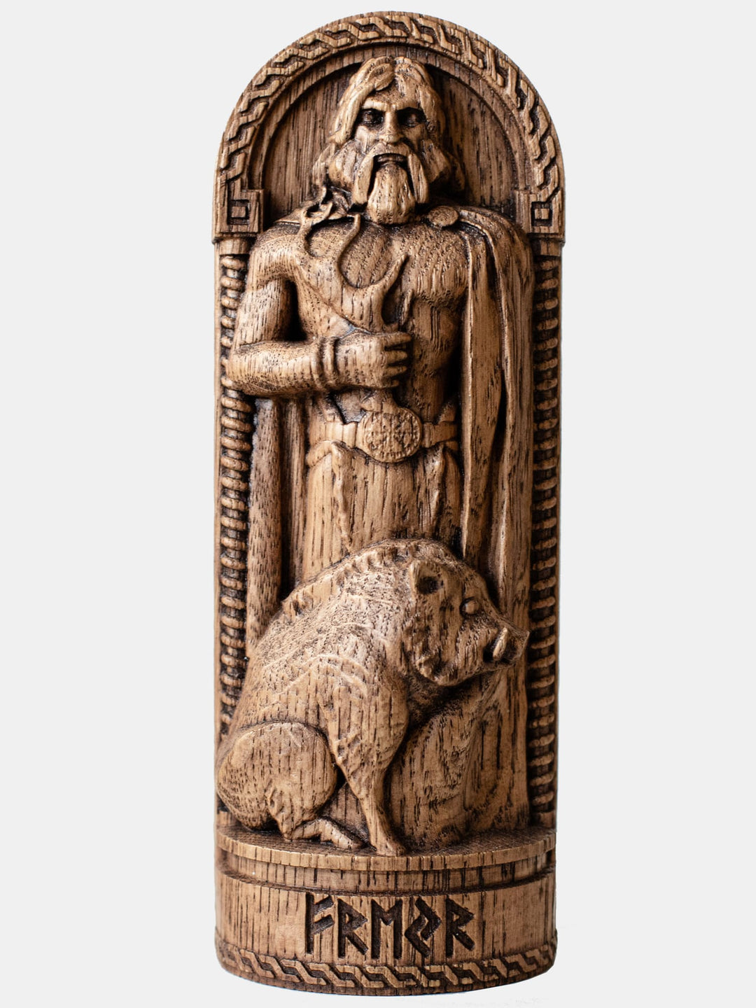 Close-up of the handcrafted oak Freyr statue, showcasing detailed carvings of Freyr with his boar, Gullinbursti, and a horn in his hand