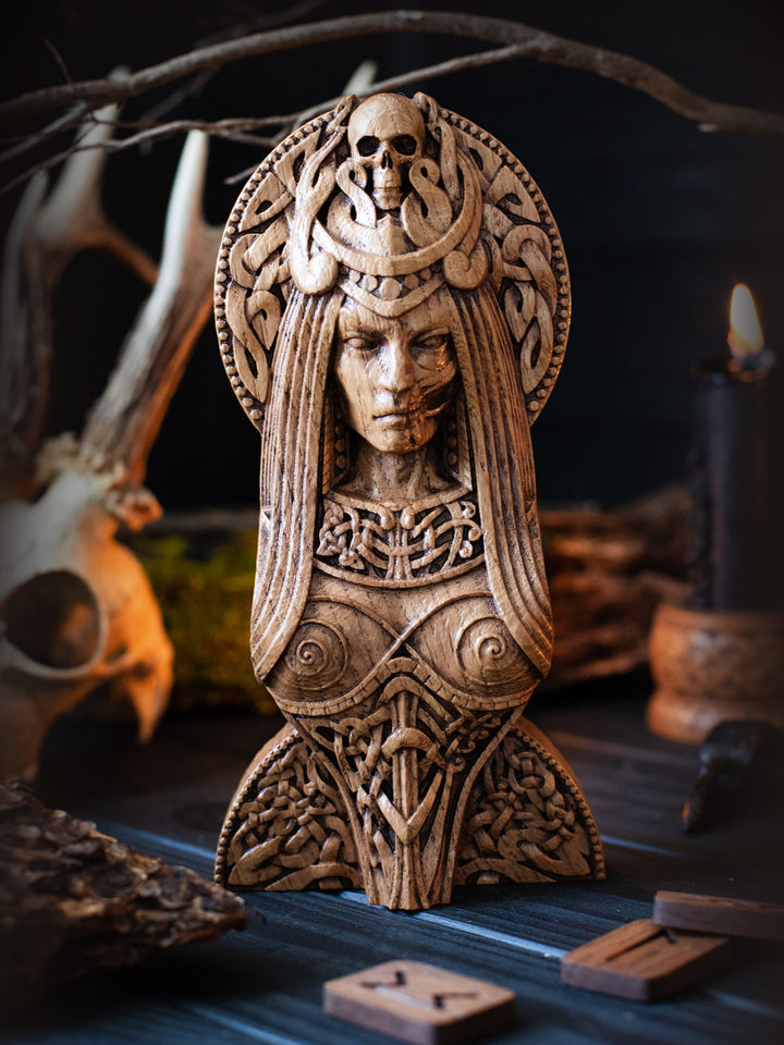 Wooden Hel figurine depicting the Queen of Niflheim, symbolizing death and balance, ideal for Norse altars.
