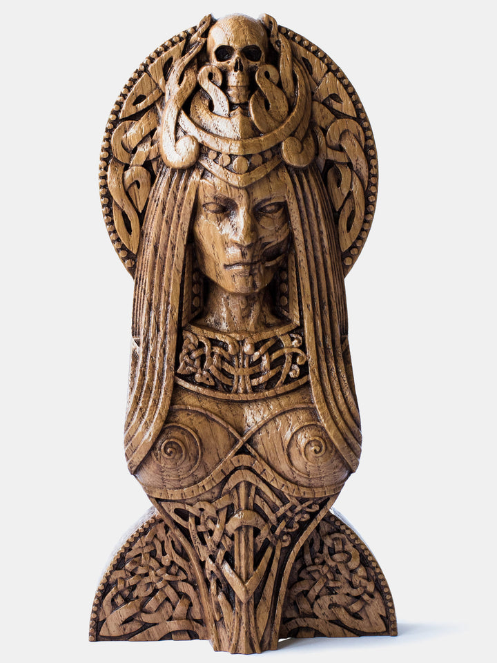 Handcrafted wooden bust of Norse Goddess Hel, with skull-crowned head, half-deceased face, and Scandinavian knotwork