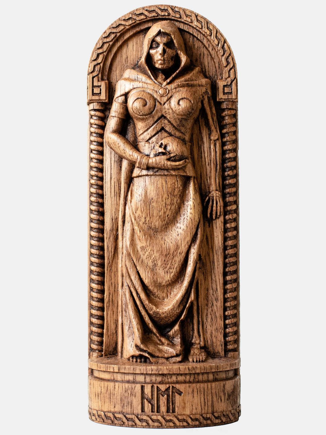Close-up of the handcrafted oak Hel statue, showcasing the dual nature of the goddess with a skull in her hand.