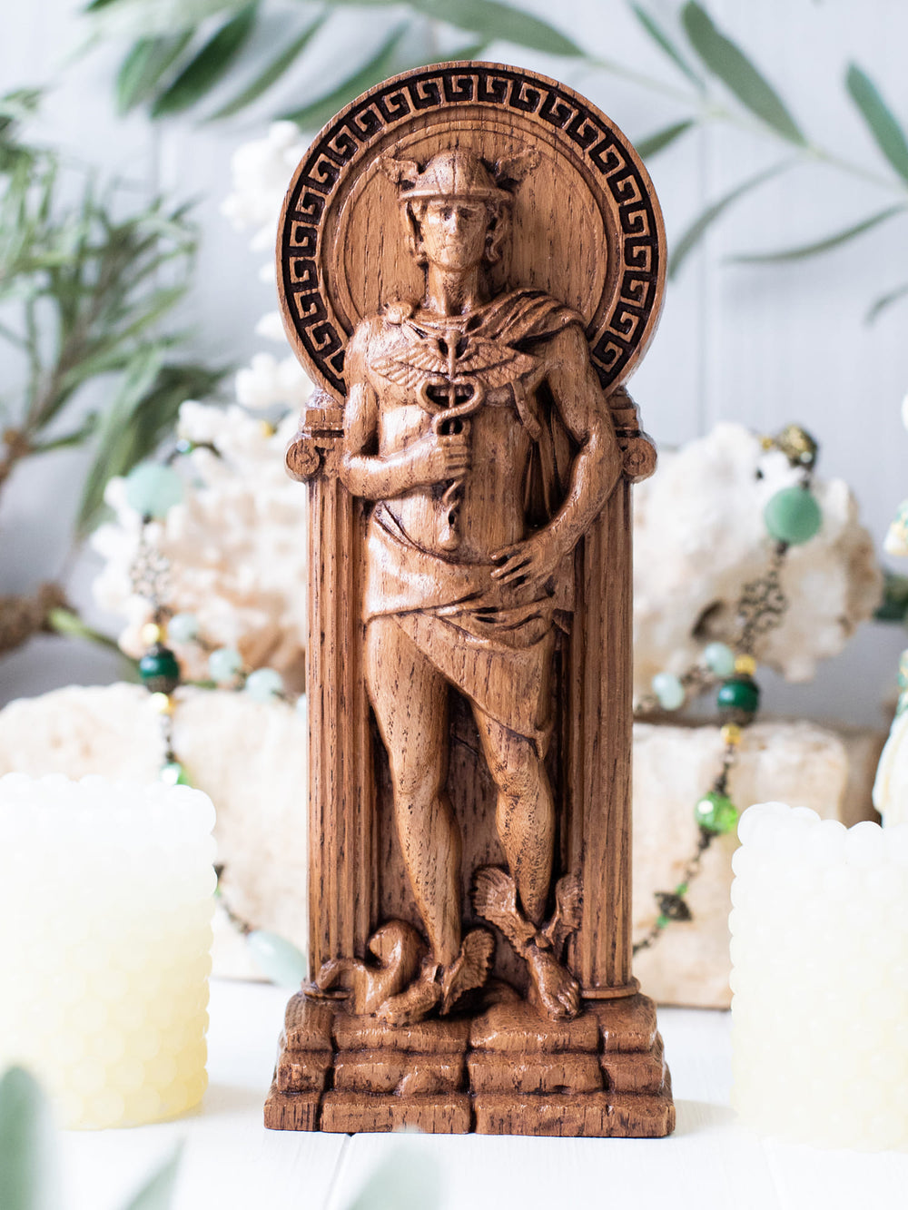 Full view of the Hermes statue from the front, highlighting its dimensions and intricate design against a plain background.