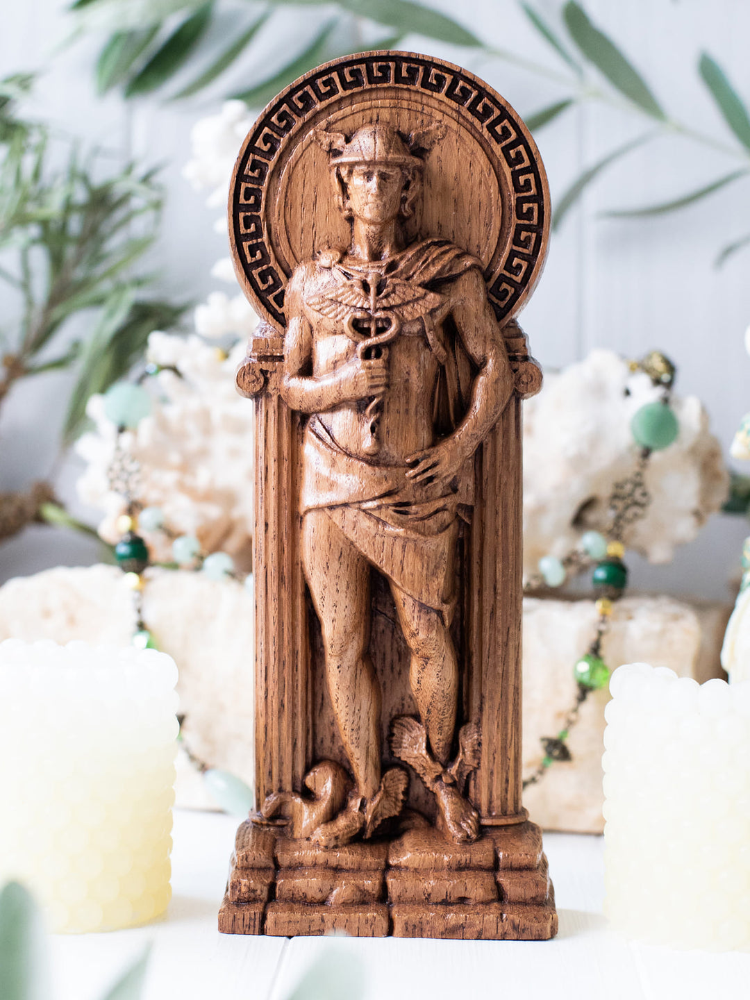 Full view of the Hermes statue from the front, highlighting its dimensions and intricate design against a plain background.