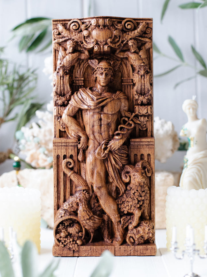 Full view of the Hermes statue from the front, highlighting its dimensions and intricate design, with a ram, a rooster, and a cornucopia filled with vegetables and fruits at his feet.