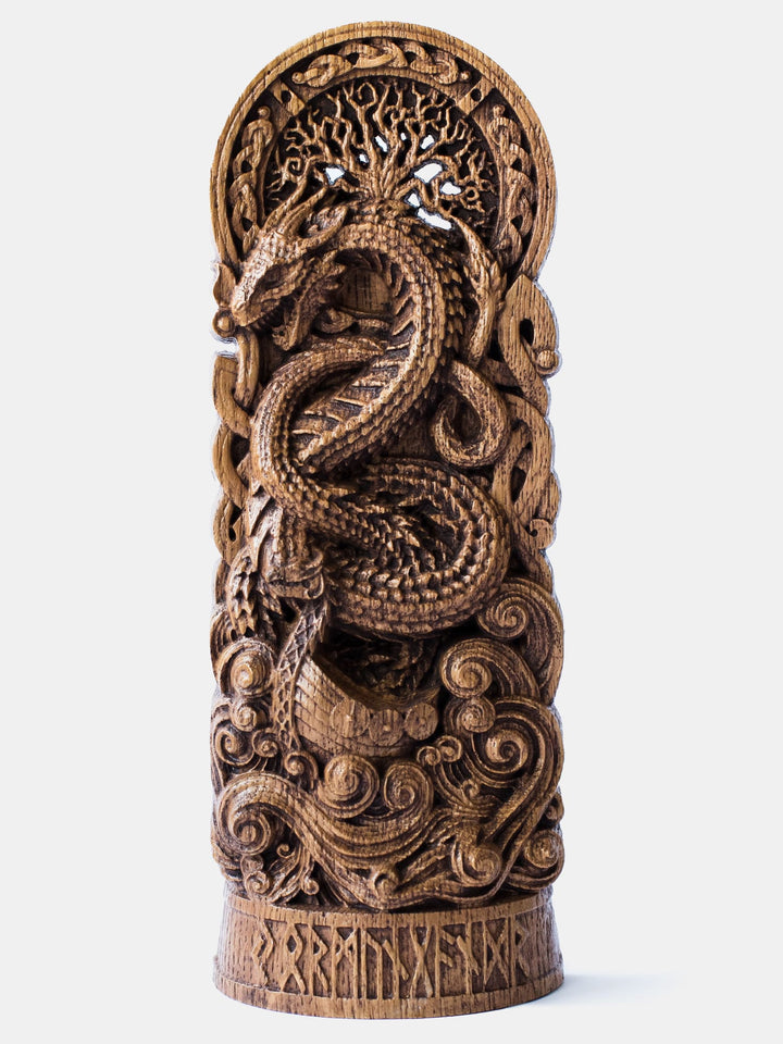 Close-up of the handcrafted oak Jormungandr statue, showcasing the giant serpent above a Viking boat with Yggdrasil in the background.