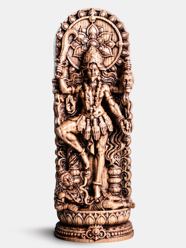 Hand carved Kali Ma goddess wooden statue for Shakti altar, yoga studio decor, and spiritual shelf display.