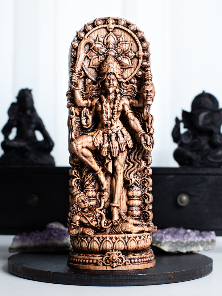 Handmade oak wood Kali goddess statue with antique patina for dark academia decor, witchy gifts, and divine feminine art.