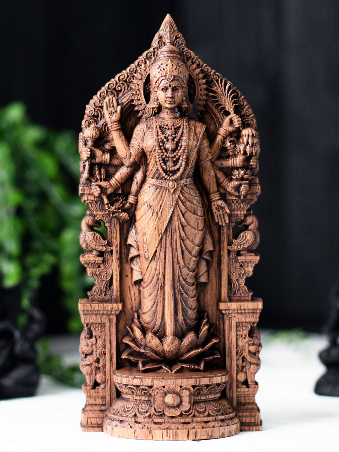 Wooden Lakshmi ji on lotus figurine with ornate Indian arch, ideal for mandir, diwali decoration, and dhana lakshmi worship