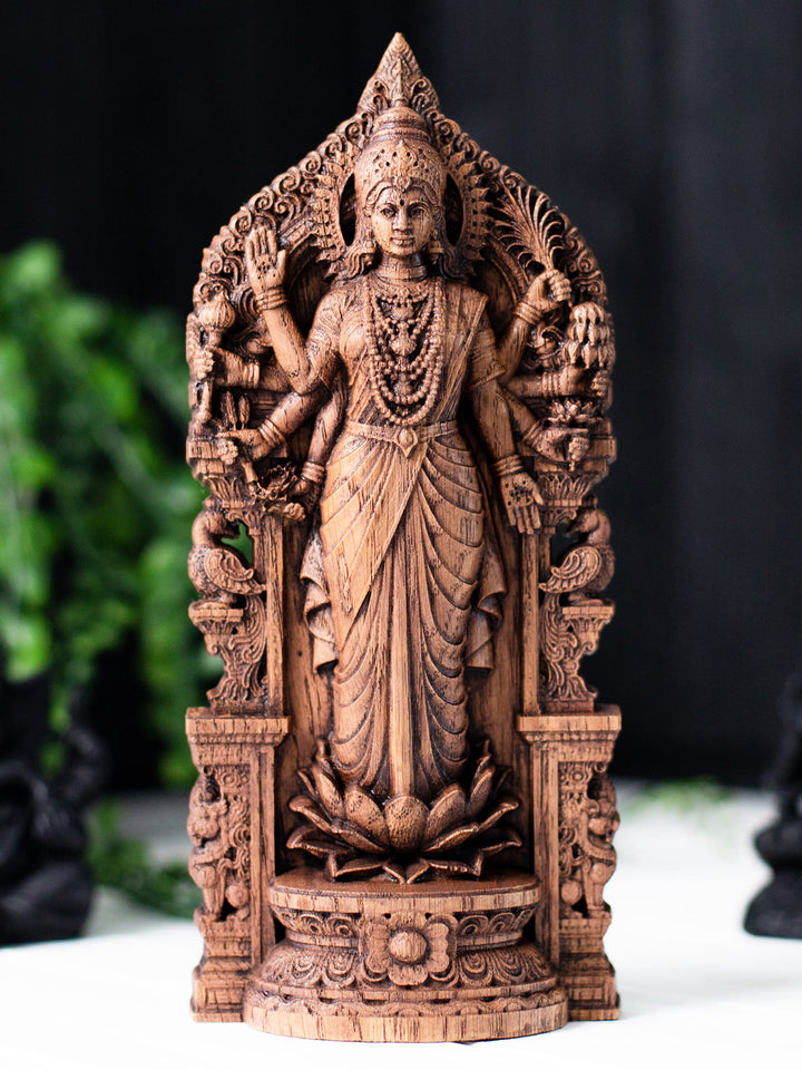 Wooden Lakshmi ji on lotus figurine with ornate Indian arch, ideal for mandir, diwali decoration, and dhana lakshmi worship