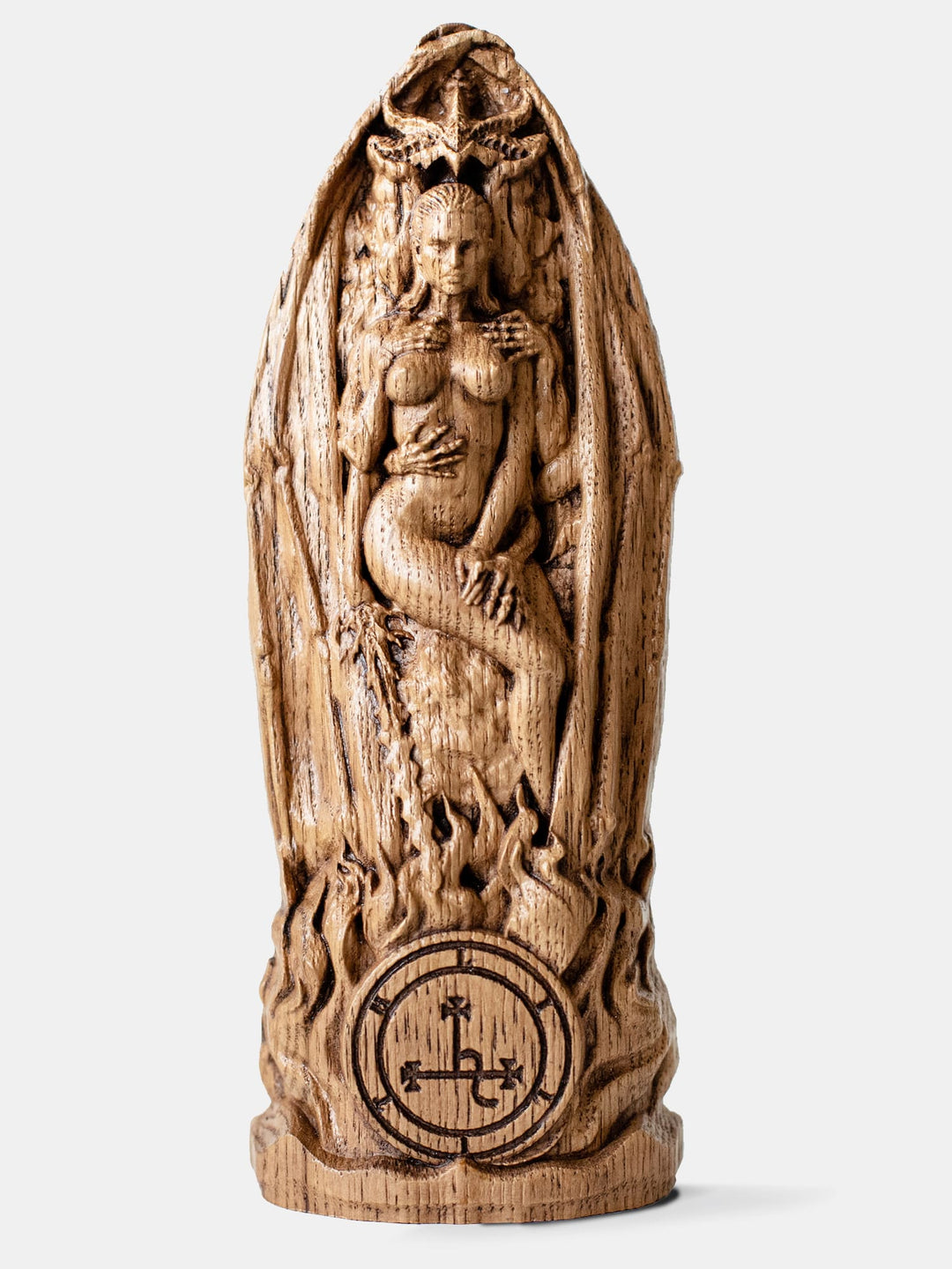 Close-up of the handcrafted oak Lilith statue, showcasing her descent into the underworld with reaching hands and Lucifer placing a crown on her.